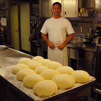 photo of Shawn Lindenmuth and fresh pizza dough