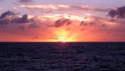 Photo of sunset at sea.